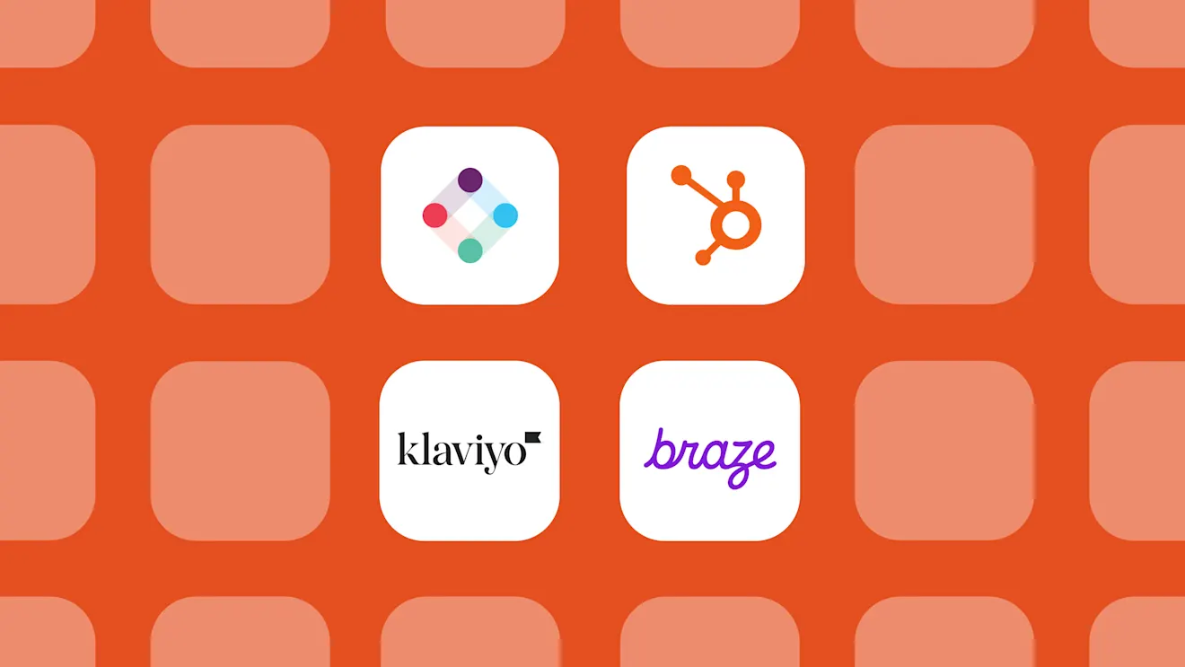 Four white app icons on an orange background showing logos for Asana, HubSpot, Klaviyo, and Braze marketing platforms