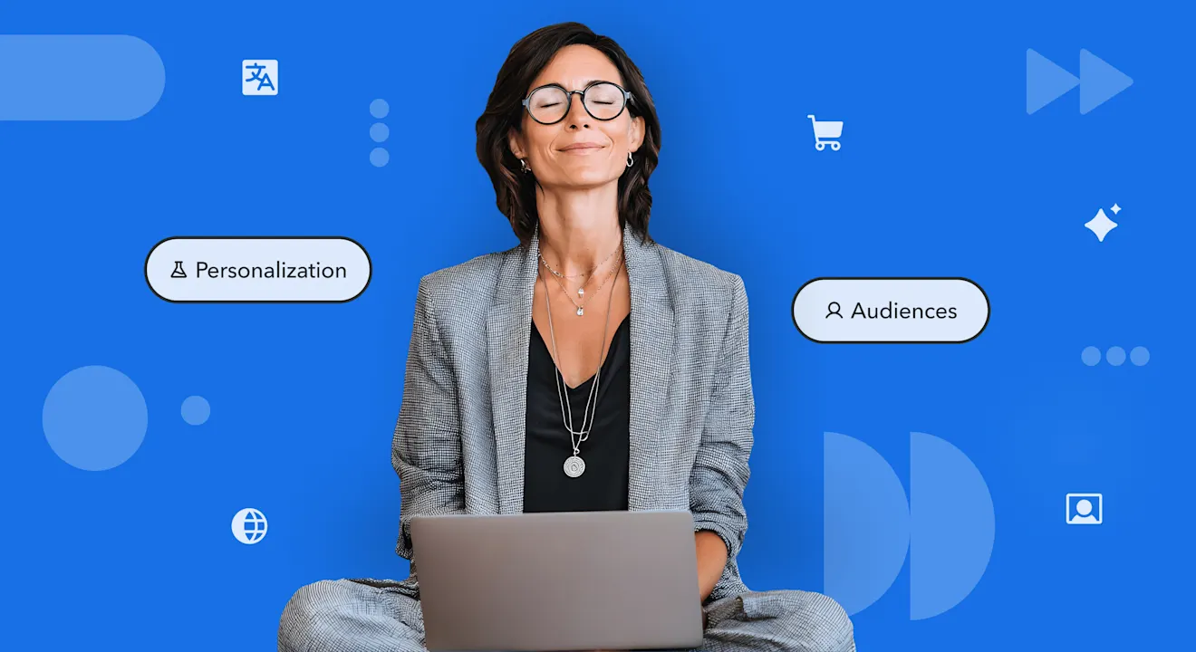 Professional in glasses using laptop against blue background with floating icons for Personalization and Audiences features