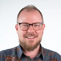 Tim Corden, Senior Director, Web Marketing at Contentful smiling.