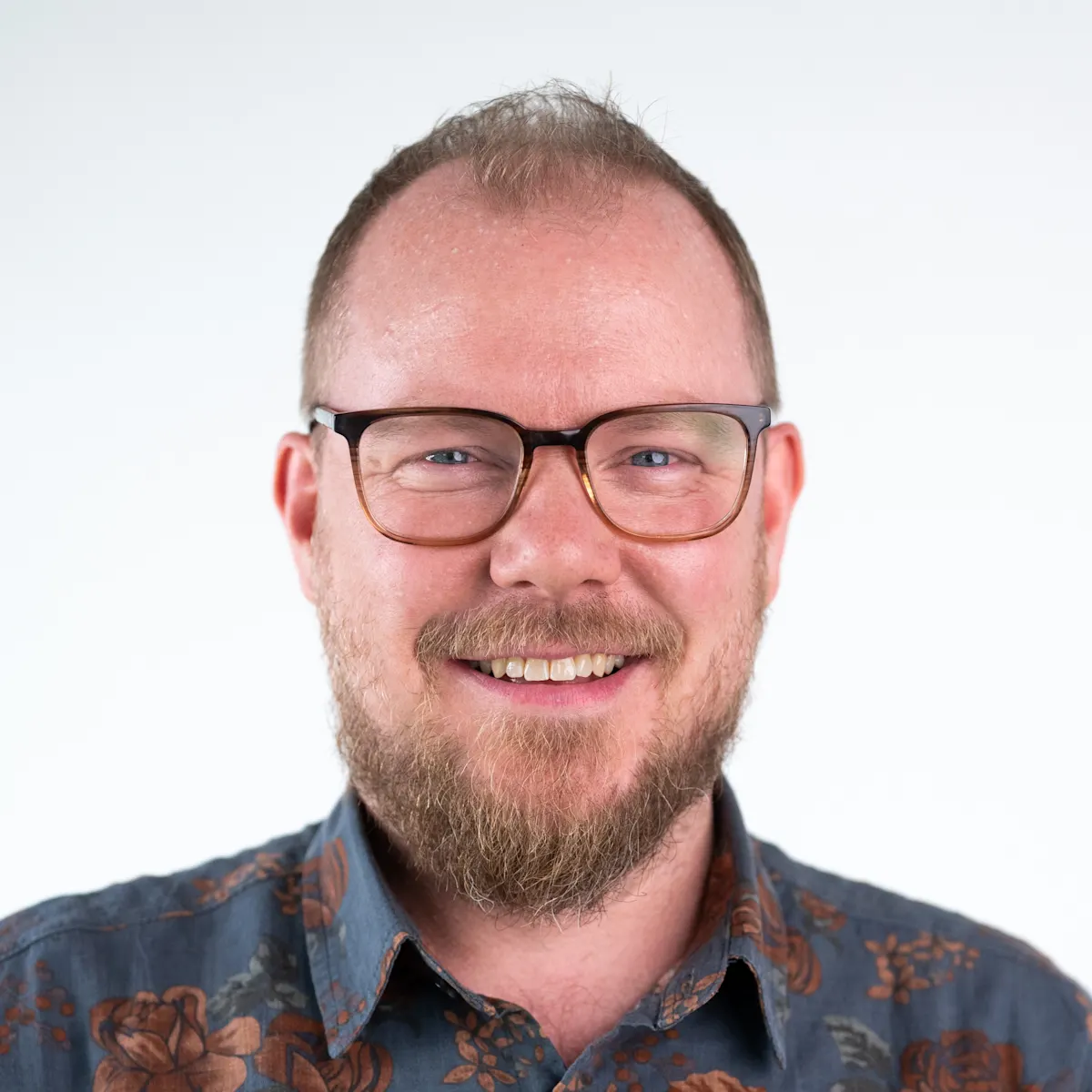 Tim Corden, Senior Director, Web Marketing at Contentful smiling.