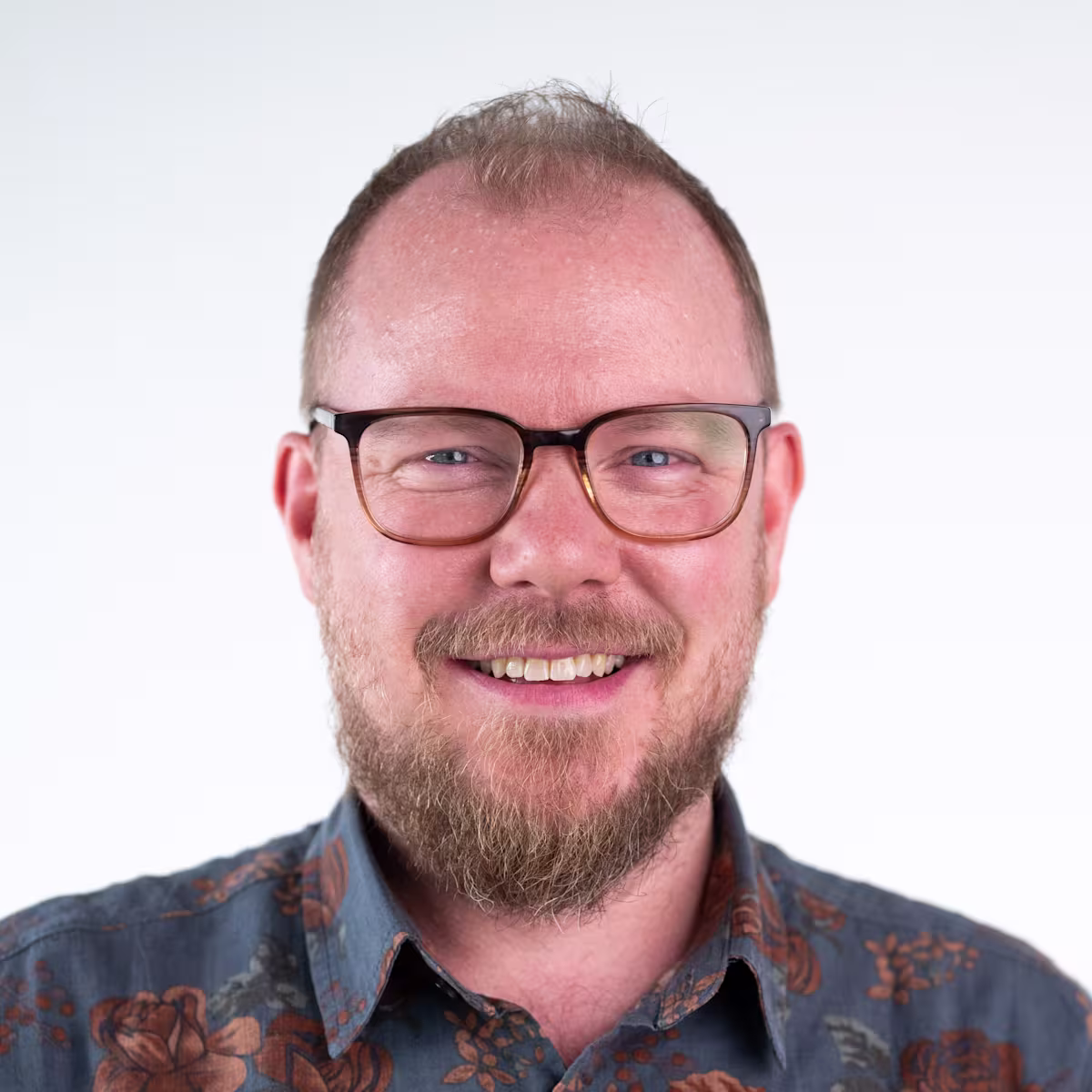 Tim Corden, Senior Director, Web Marketing at Contentful smiling.