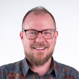 Tim Corden, Senior Director, Web Marketing at Contentful smiling.