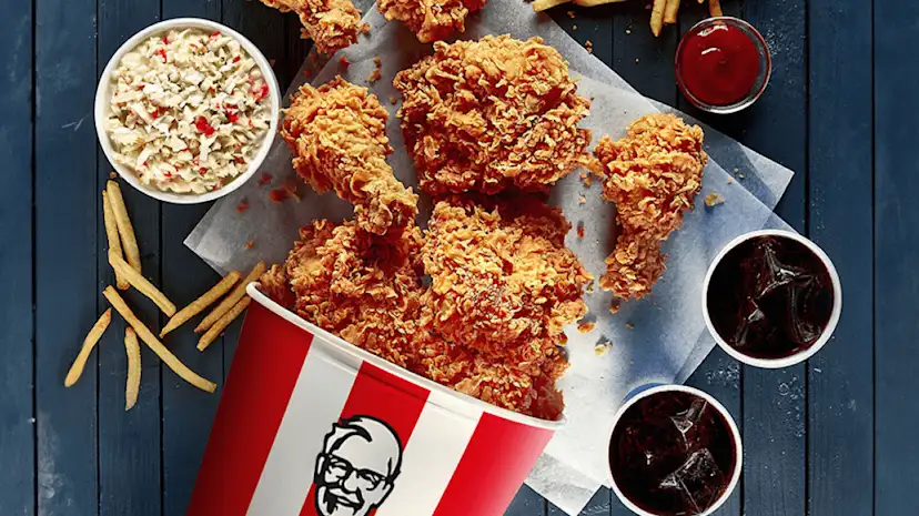 A selection of KFC products on a table viewed from above.