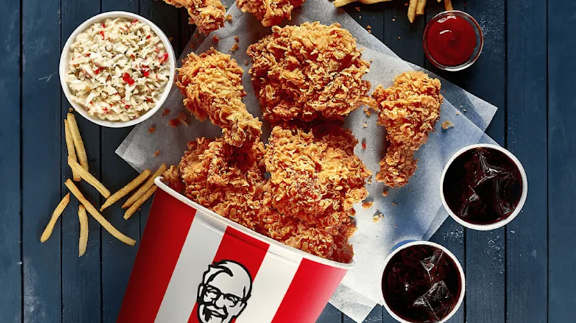 A selection of KFC products on a table viewed from above.