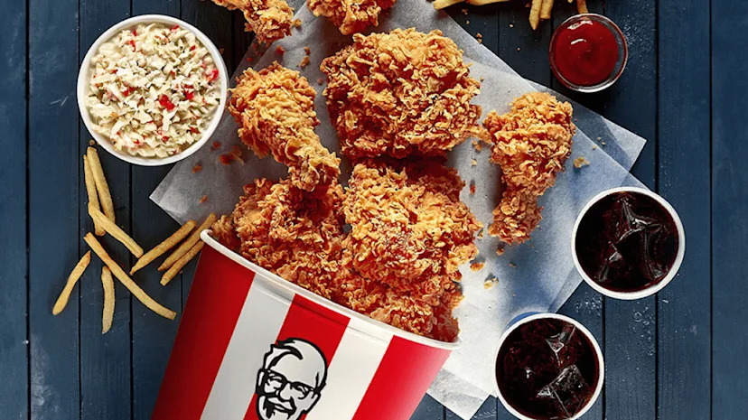 A selection of KFC products on a table viewed from above.