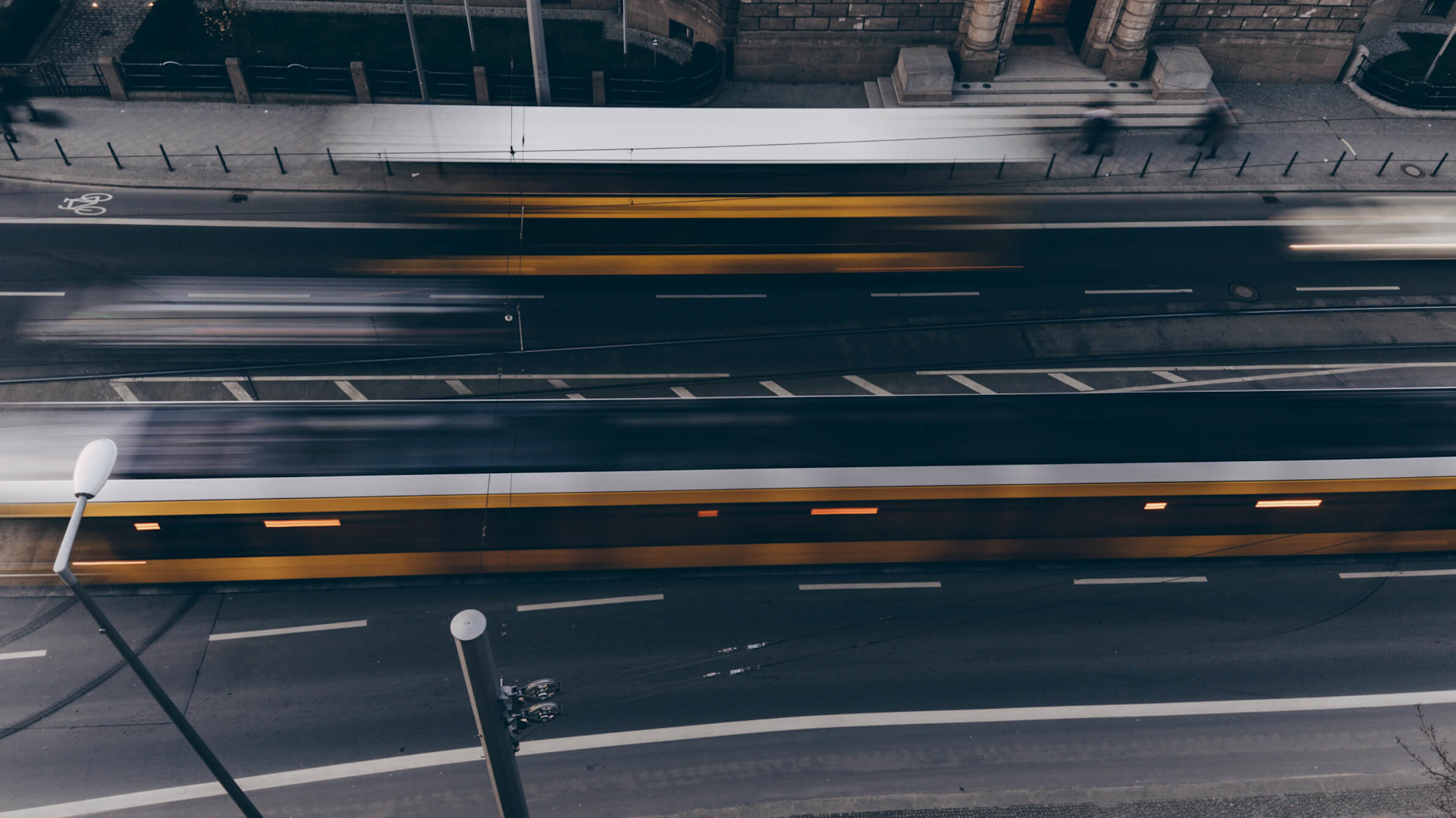 Overhead shot of a busy street with motion blur on the traffic