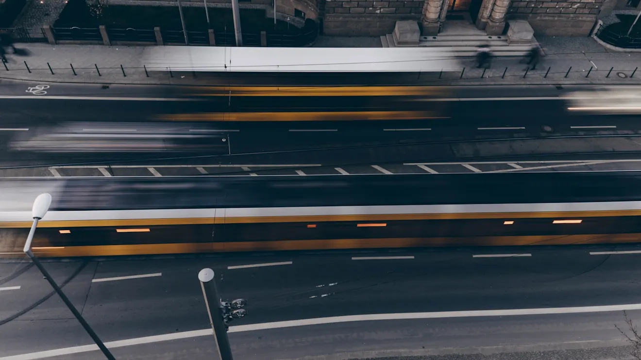 Overhead shot of a busy street with motion blur on the traffic