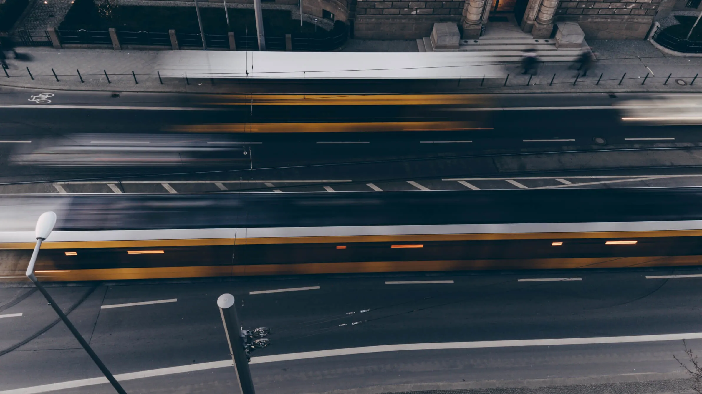 Overhead shot of a busy street with motion blur on the traffic