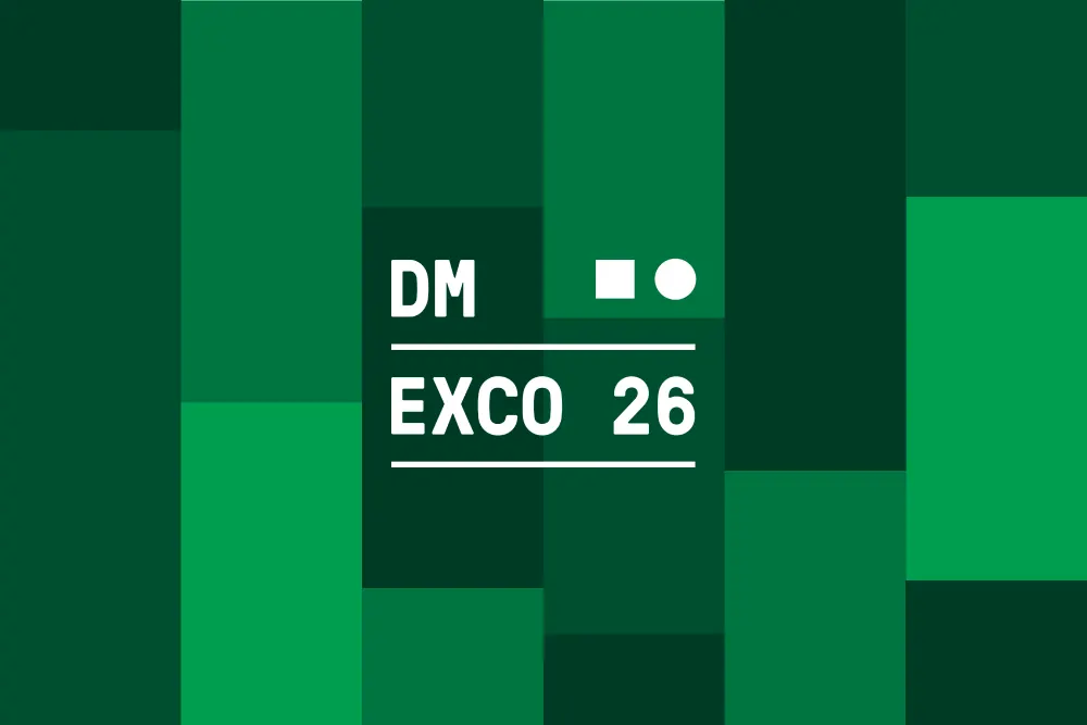 DMEXCO 26 logo in white text on a dark green background with a mosaic pattern of various green shades.
