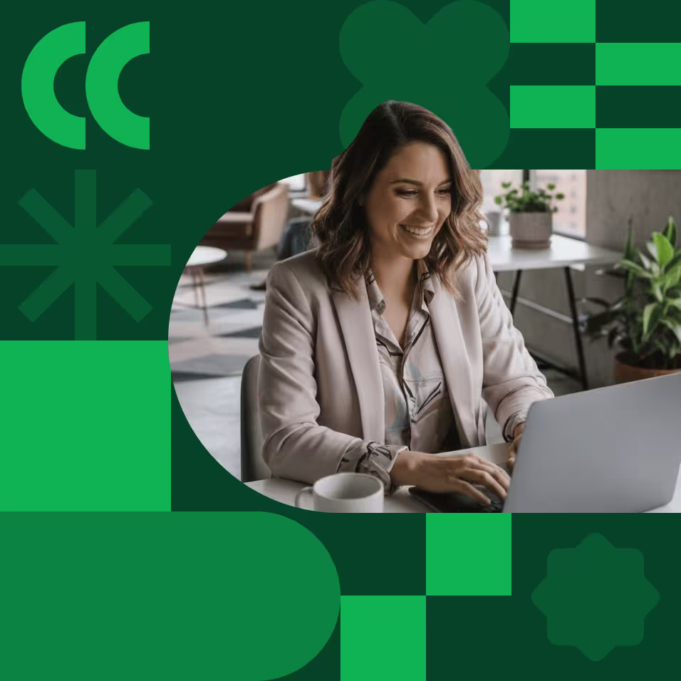 A smiling woman in a beige blazer works on a laptop in a modern office, framed by a green geometric graphic design.