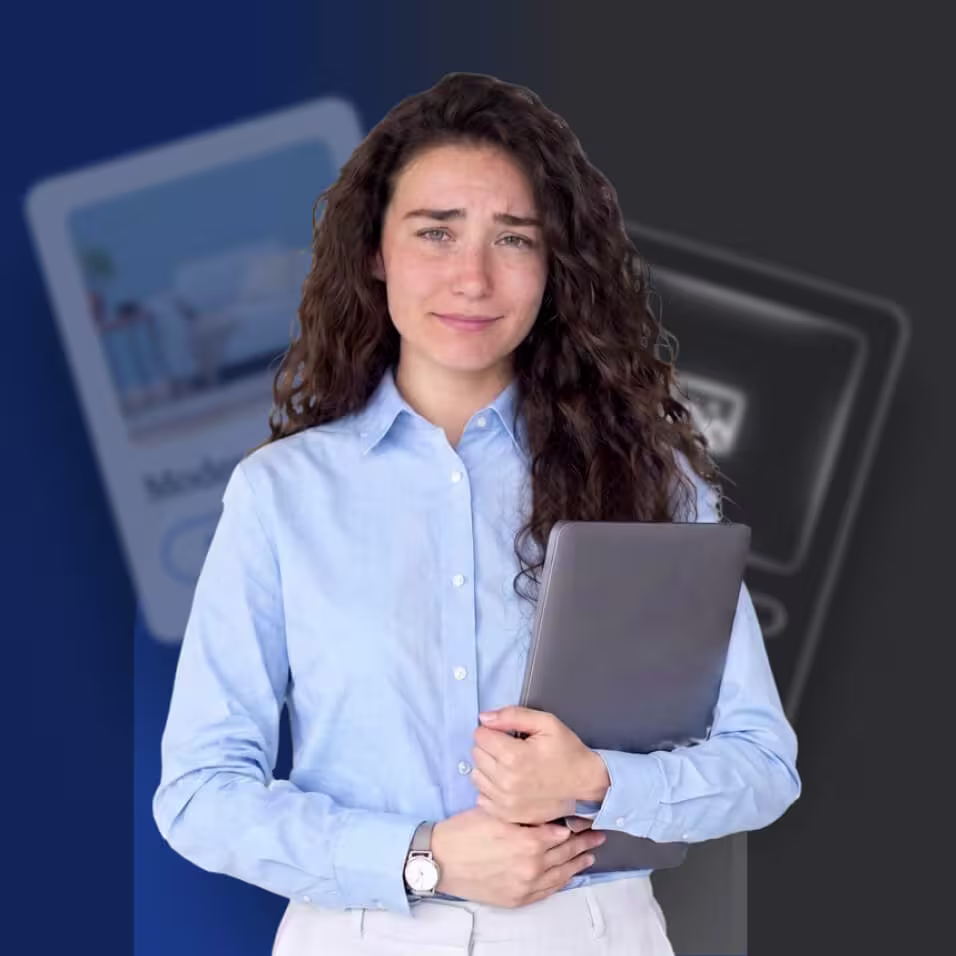 A young woman with curly brown hair, looks disappointed in a blue shirt while holding a laptop, standing against a blue and gray background.