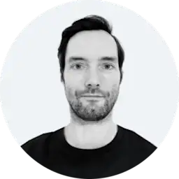 Black and white headshot of Paul Baron from AQ