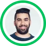 Headshot portrait of a smiling person with dark beard against green circular background