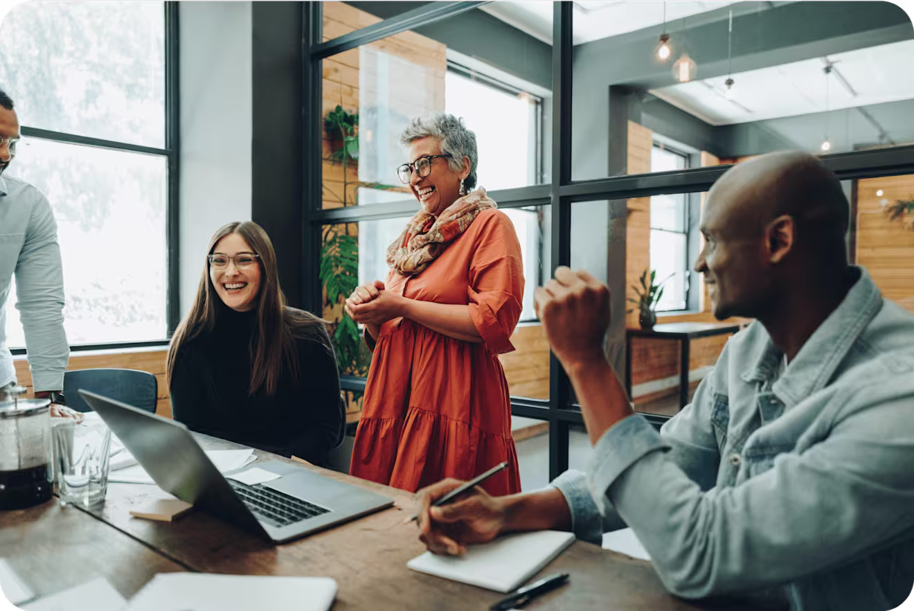 A group of colleagues collaborate in a meeting