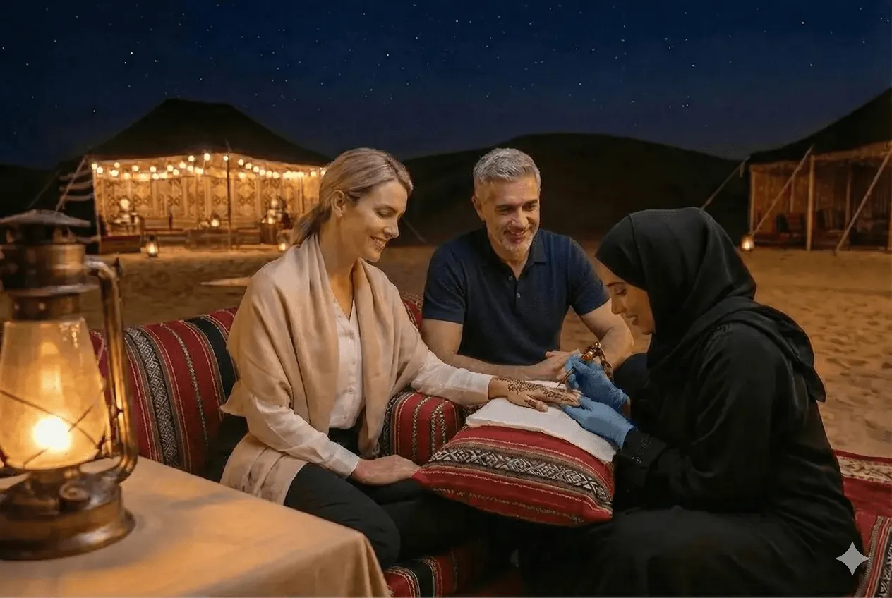 Couple enjoying evening dinner at desert camp with traditional cushions and lanterns under starlit sky, illuminated tent in background